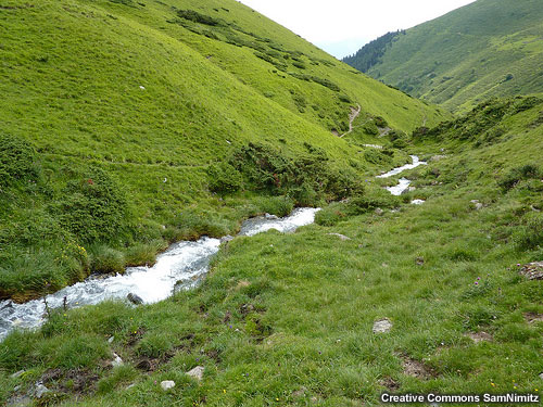 Small stream flowing through a valley near the French Pyrenees mountains